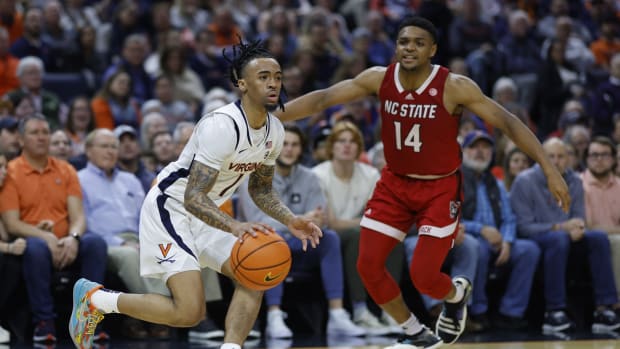 Dante Harris pulls up for a jump shot during the Virginia men's basketball game against NC State at John Paul Jones Arena.
